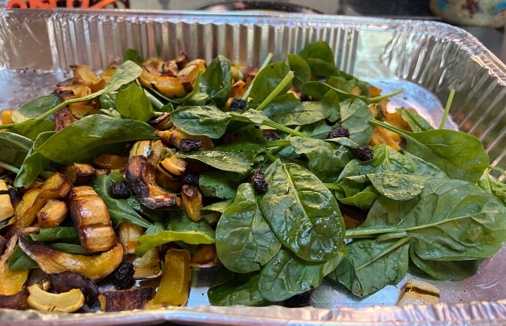 Roasted delicata squash with fresh baby spinach